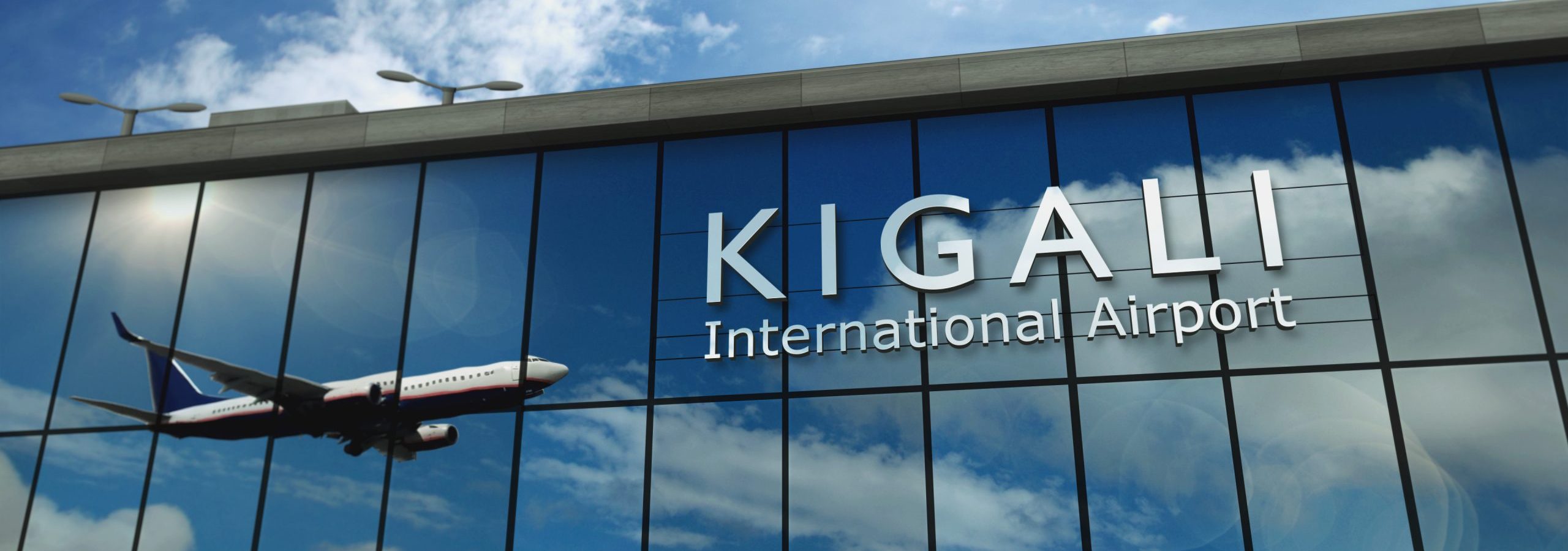 Airplane landing at Kigali Rwanda airport mirrored in terminal