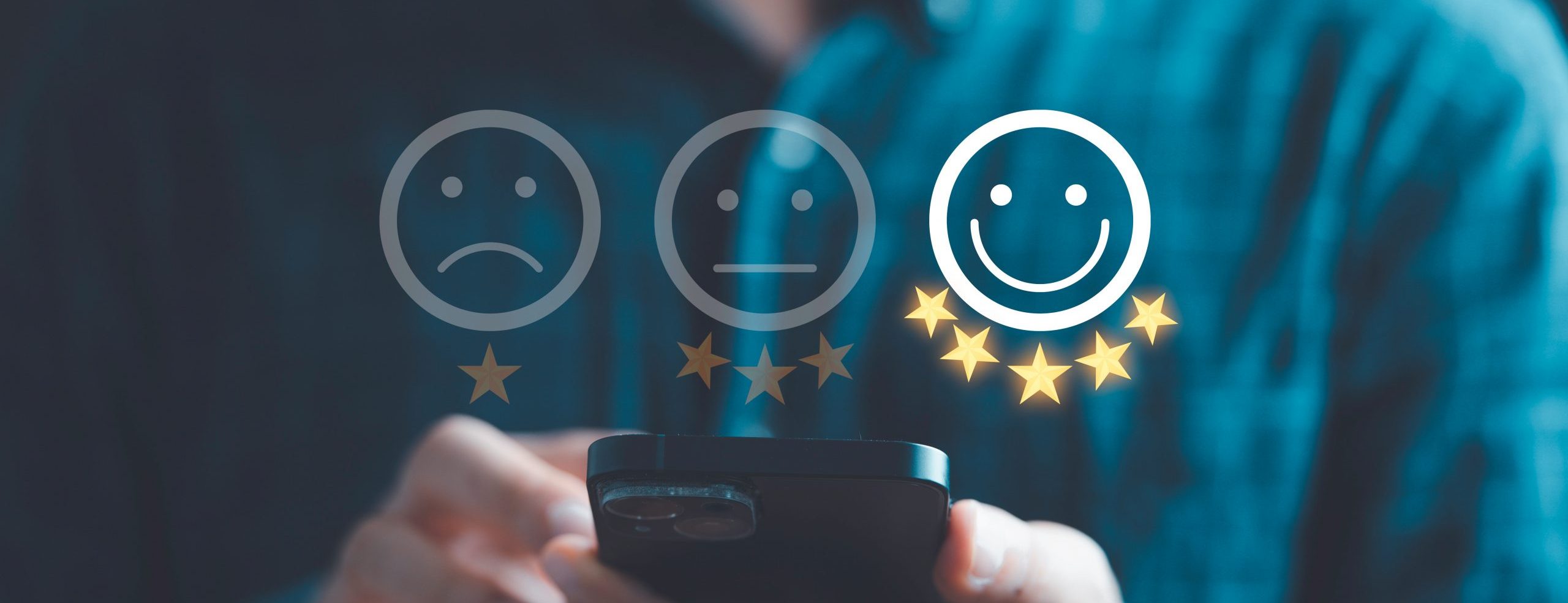 Businessman using smartphone to give five glowing golden stars and smile face icon for excellent evaluation survey after client use product and service from customer satisfaction concept.