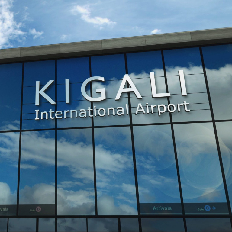 Airplane landing at Kigali Rwanda airport mirrored in terminal